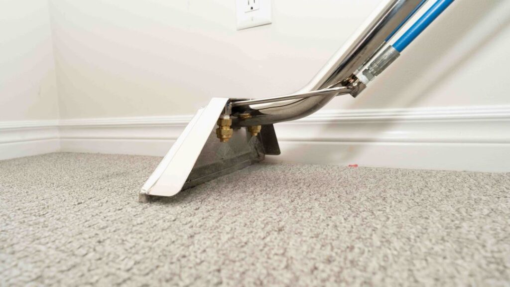 The wand tool used to clean carpets is guided along by a My Fresh Carpet technician.